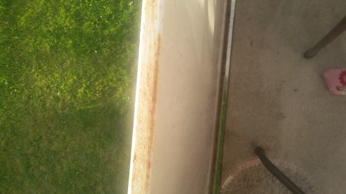 This shows the gap between the balcony floor (you can see the grass showing through) and the wall.