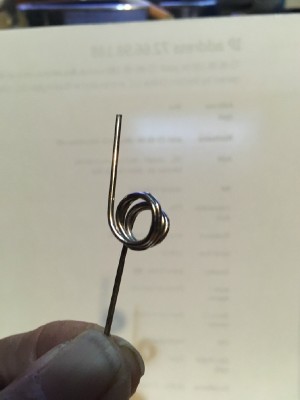 bent a paperclip around a drill bit. Keep water line in place...