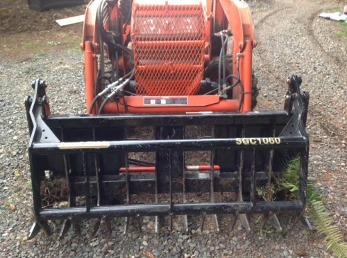 The cross shaped metal I put on to keep sticks from damaging the front of the tractor