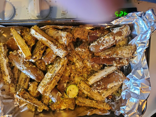 zucchini and eggplants seasoned and ready to brown in the oven