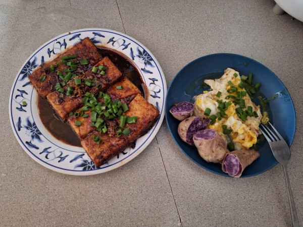 My dinner tonight on the right.  I added the lettuce after I took the picture.  I had one of the tofu steaks. The other three will be for other meals.