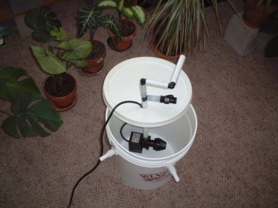 The pump in an old Wine Kitz primary fermenter, or just call it a 5 gallon bucket... After the plug and 3/4&quot; PEX and  an air hose is feed through the hole in the lid there is little room for anything else. There is a shut off valve on the riser off the pump I am going to use it for discharging the reservoir. In the yard the is a drop in elevation of at least 4 feet with out setting up a level and transom so sophomoric action should help, I will probably put in a shut off on the feed side to assist flushing .